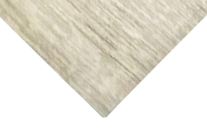 Gabbeh rug close-up, light beige-toned pile texture with fine strands