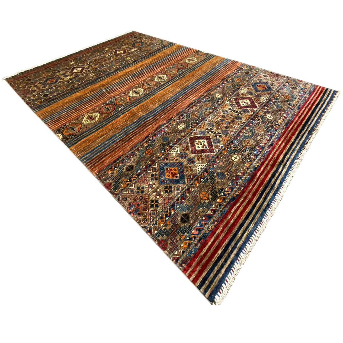 Colorful Oriental rug with a geometric pattern in shades of brown, blue, and orange, shown at a diagonal angle.