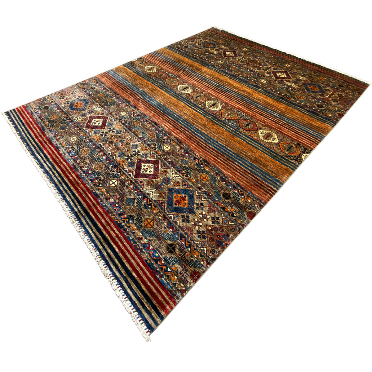 Colorful rug with geometric patterns, brown background, blue and orange stripes, and fringes.