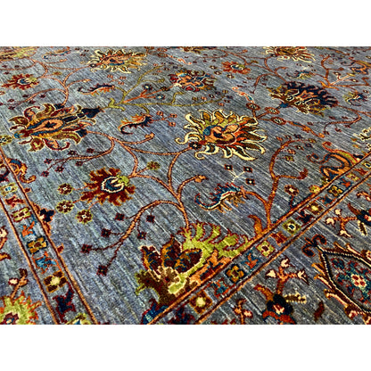 Close-up: gray Oriental rug with colorful floral ornaments