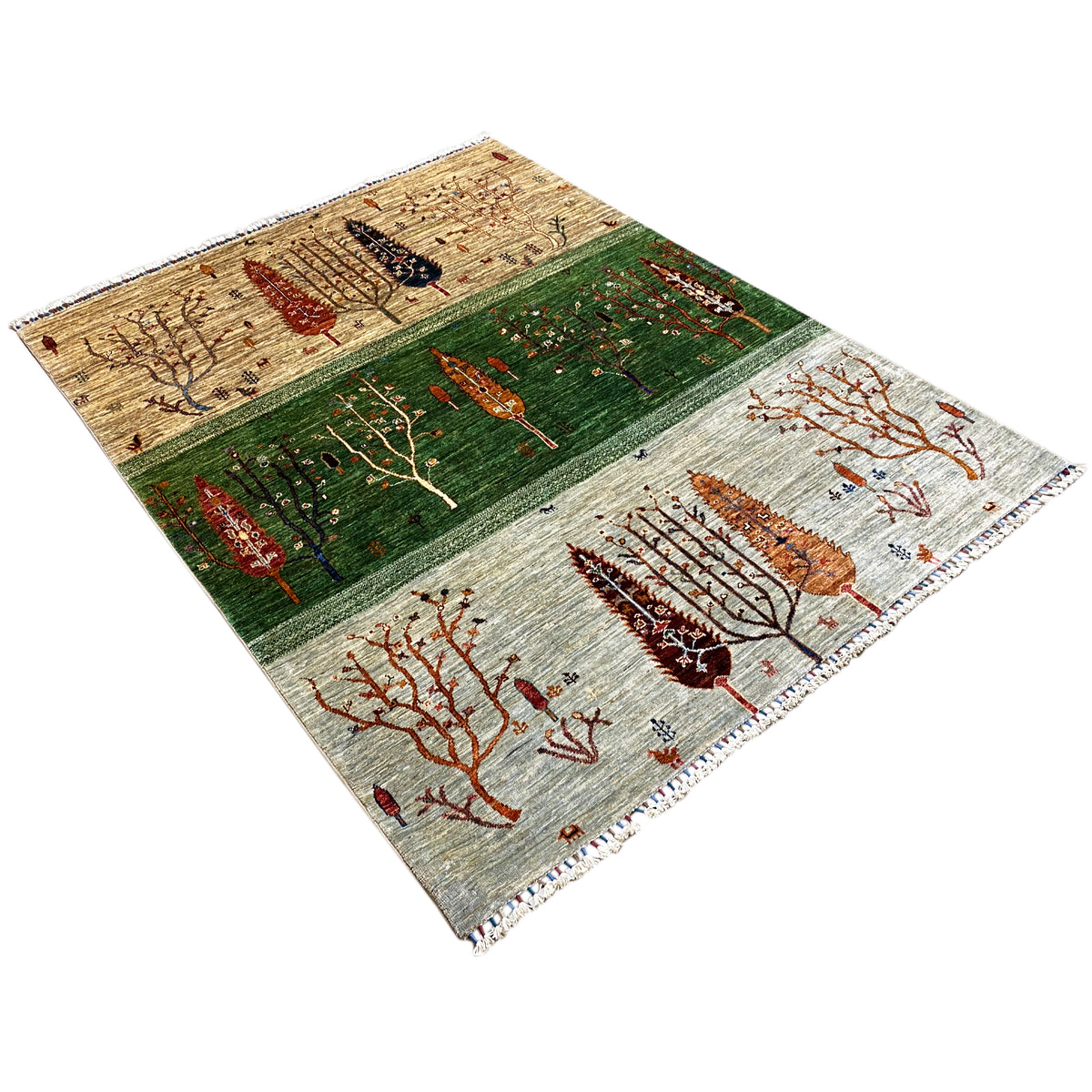 Khorjin rug with tree motifs in green and rust red on a light background, with fringes