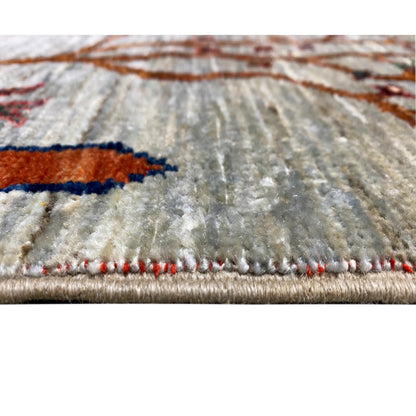 Khorjin rug edge with decorative fringes and multicolored embroidered details, visible woven texture