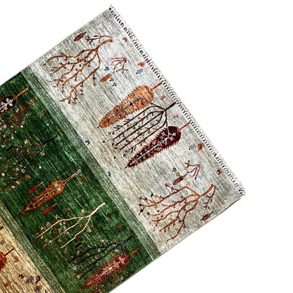 Khorjin rug corner with tree ornaments in orange, green and beige, with fringes