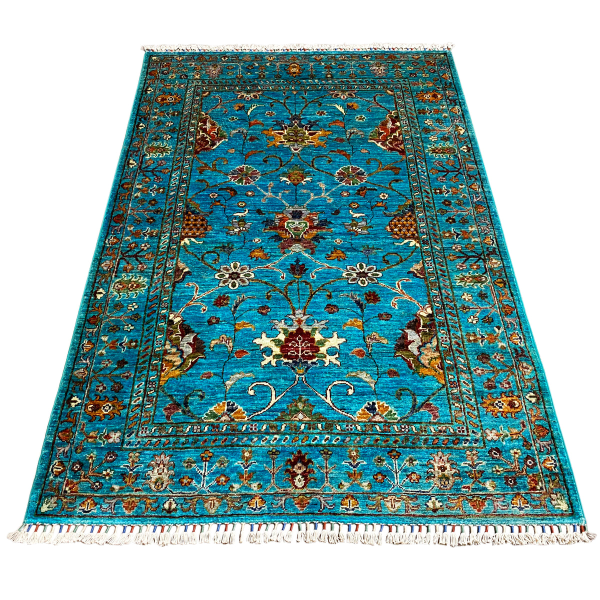 Turquoise Khorjin rug with a large pattern and medallion, fringes along the edge