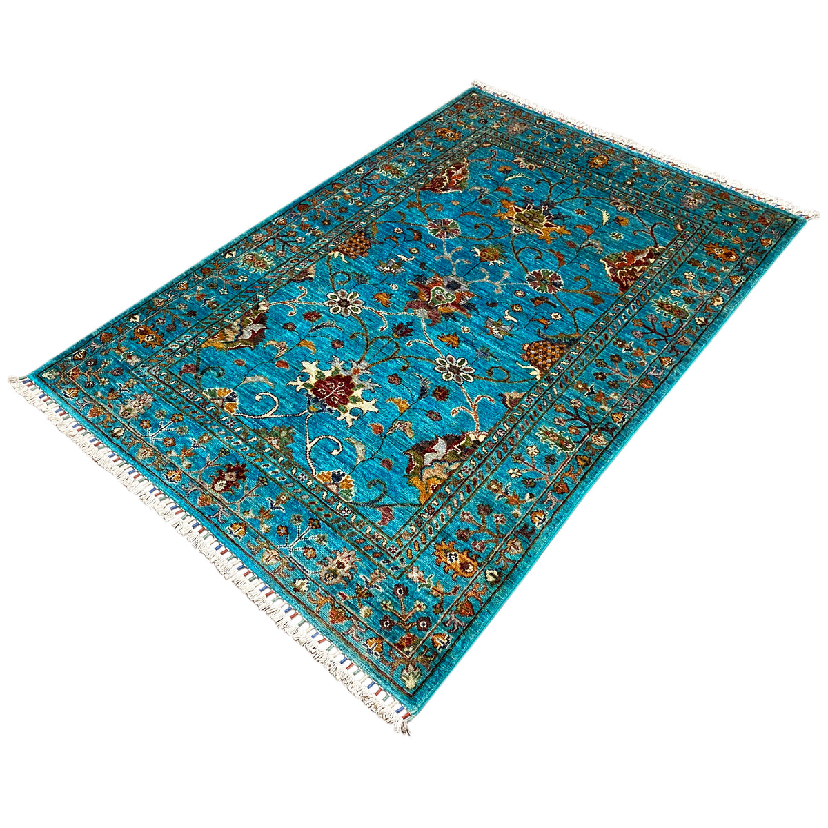 Turquoise Khorjin rug, diagonal image with central floral motifs, fringes