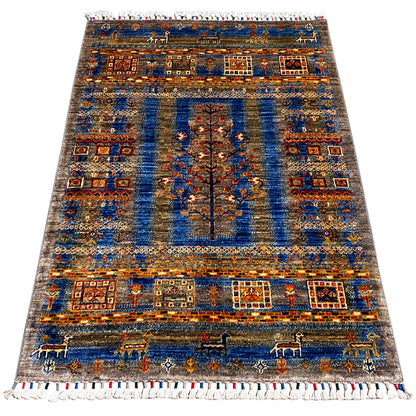 Blue-brown Khorjin rug with geometric rows, a central ornamental border, and a white fringed edge