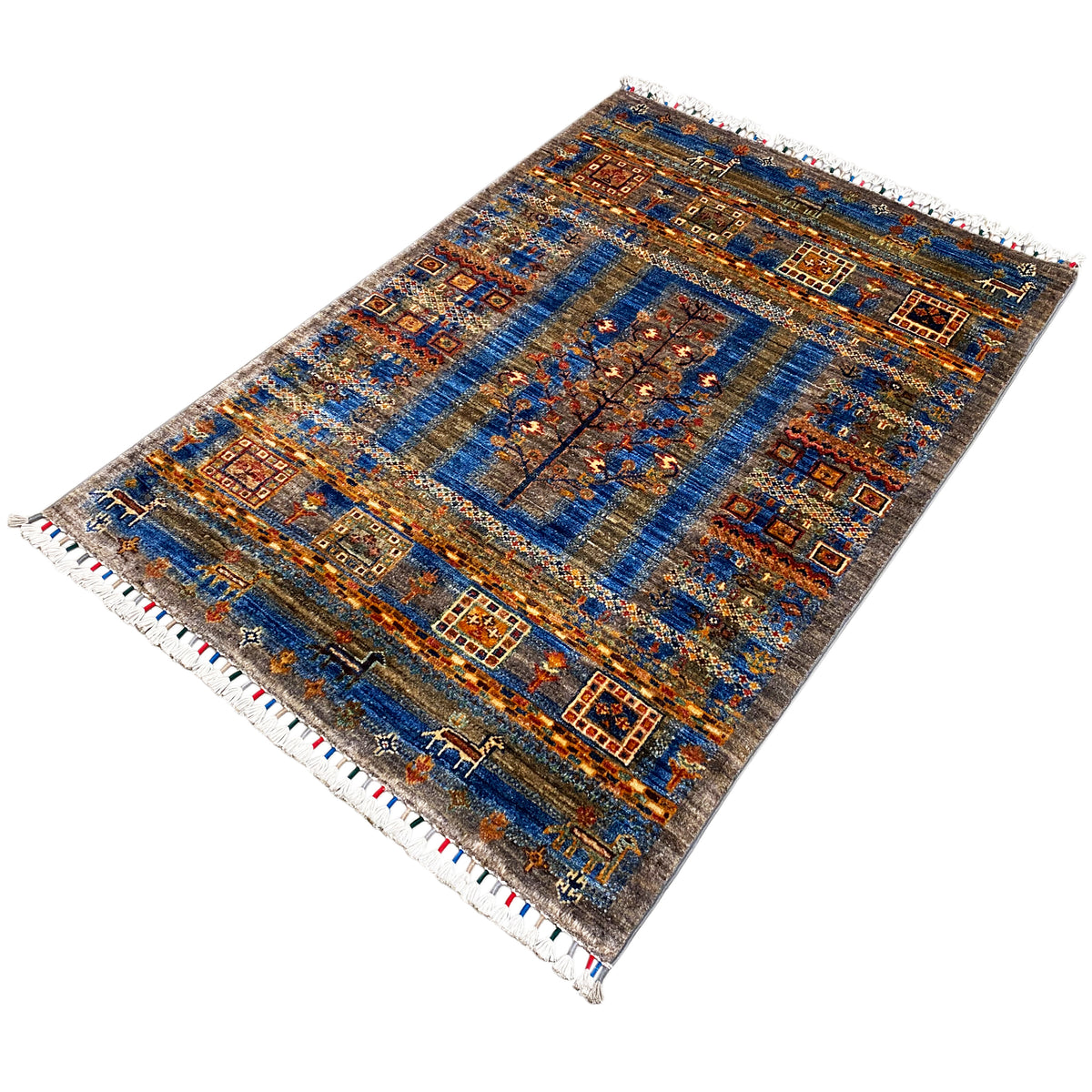 Khorjin rug in blue and brown with richly decorated borders, central tree/medallion motif, fringes