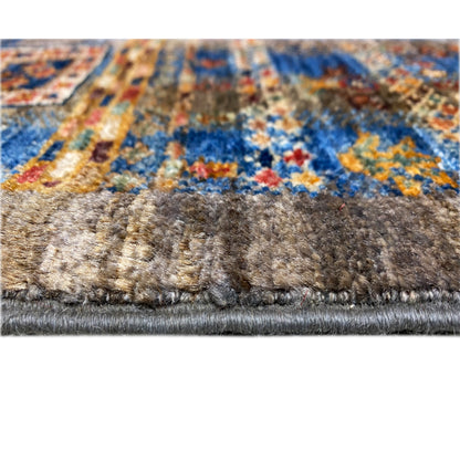 Rug border with dense gray-brown pile, colorful patterned area, and white fringe strip