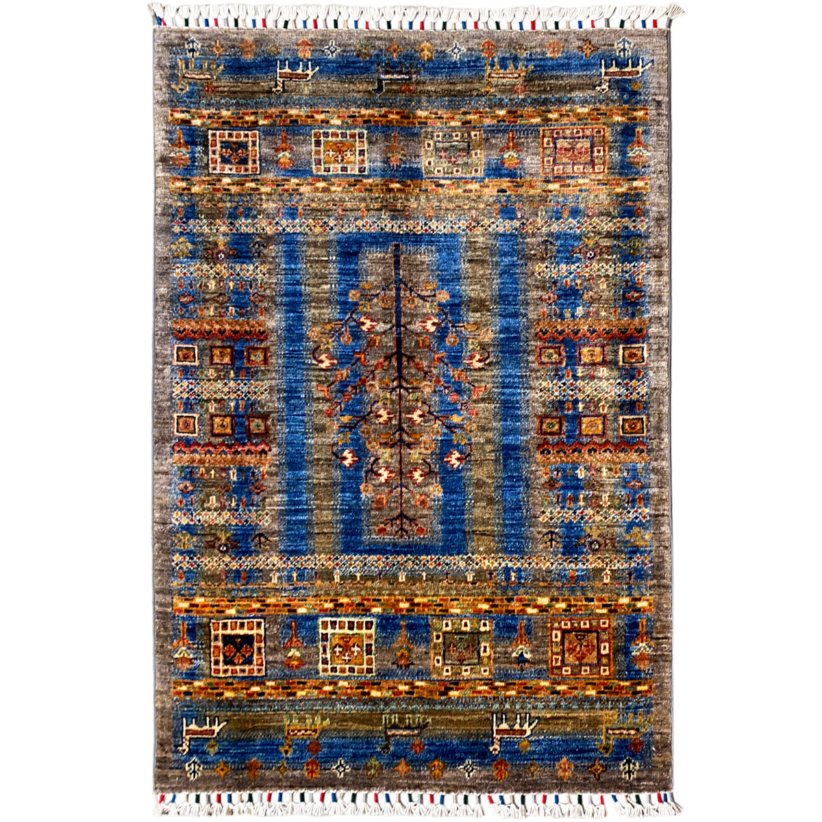 Blue-brown Khorjin rug with a central medallion, geometric patterns, and a white fringed border