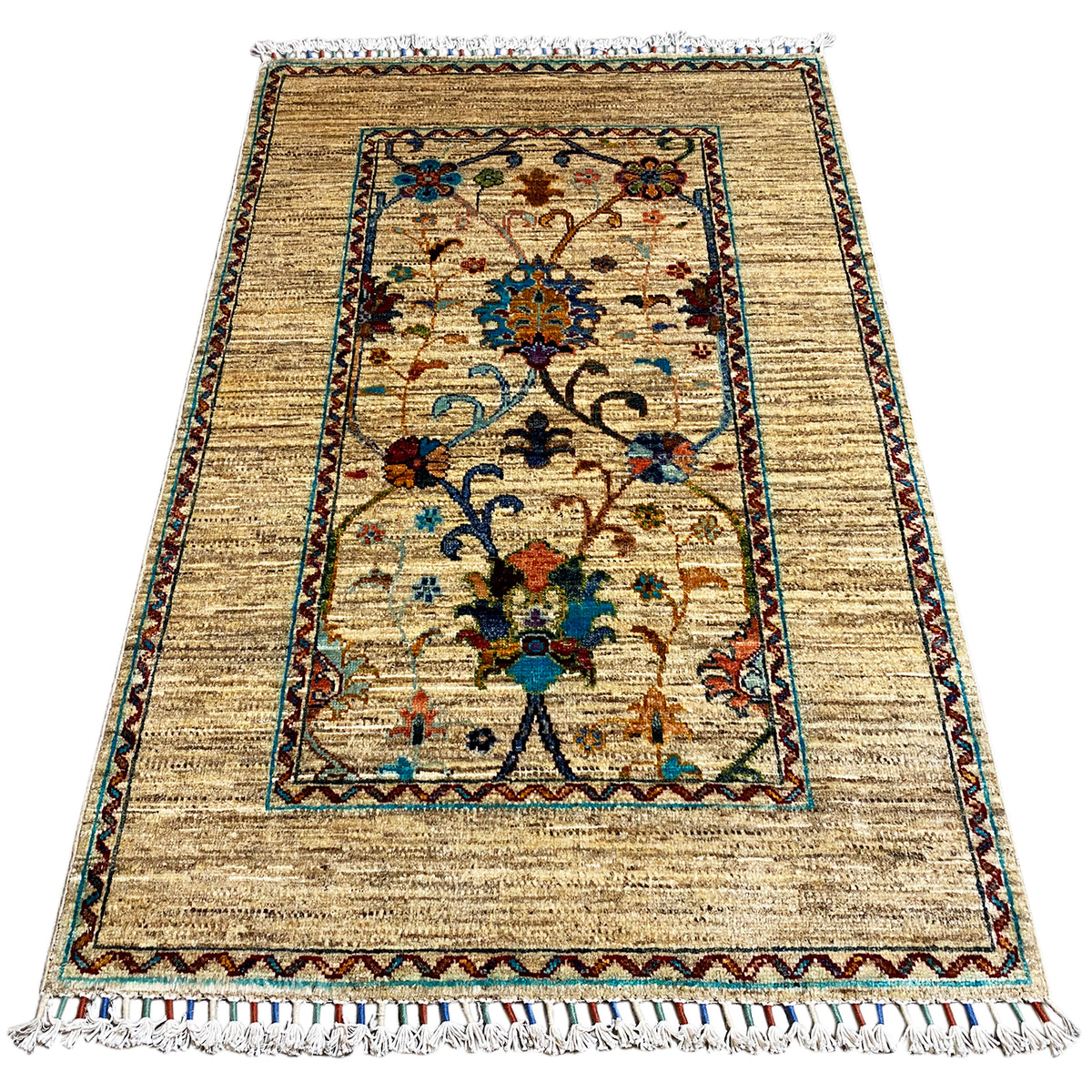 Beige Khorjin rug 126x85 cm with central ornamental field, decorative border, and fringes