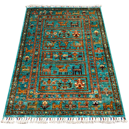 Rectangular turquoise Khorjin rug with a multi-part border and fringes, 119x83 cm.
