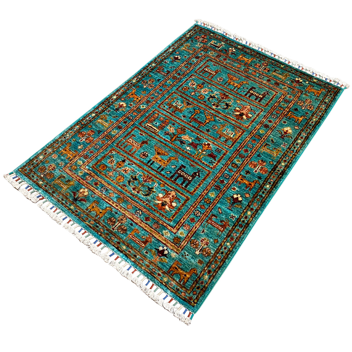 Turquoise Khorjin rug spread out, with decorative border lines and fringe along the edge.