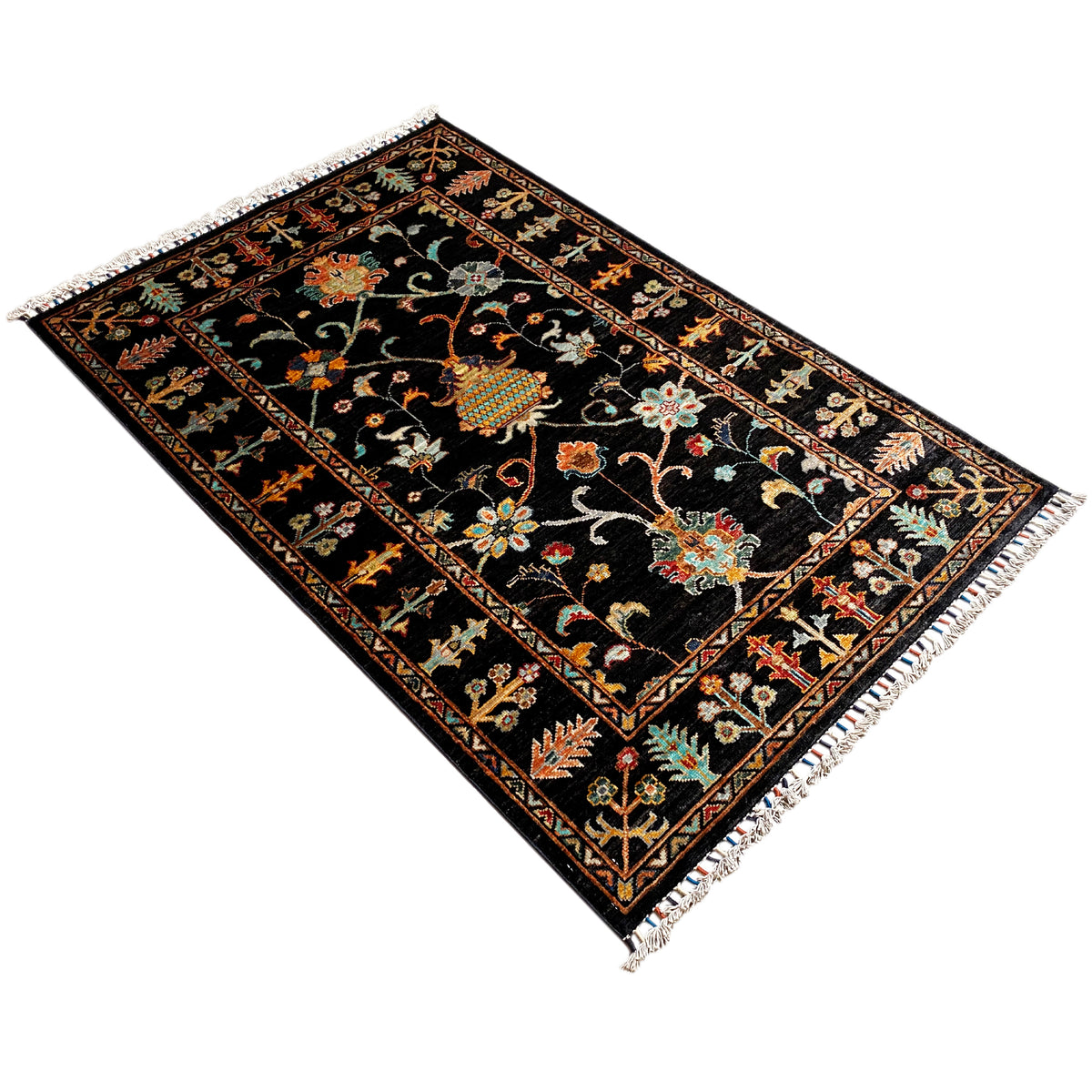 Khorjin rug 143x96 cm in black with colorful ornaments and a stepped border, fringe