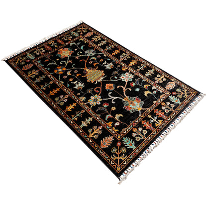 Khorjin rug 143x96 cm in black with colorful ornaments and a stepped border, fringe