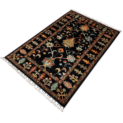 Khorjin rug 143x96 cm, black rug with a colorful floral pattern and decorative border, fringe