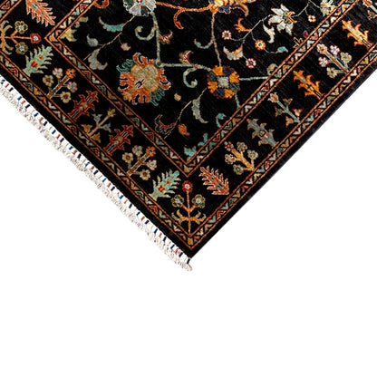 Corner of the Khorjin rug, 143x96 cm: black pattern with a colorful border, white fringes