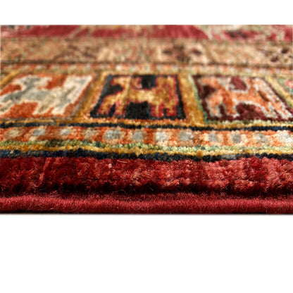 Close-up of the carpet edge with red pile and colorful pattern elements
