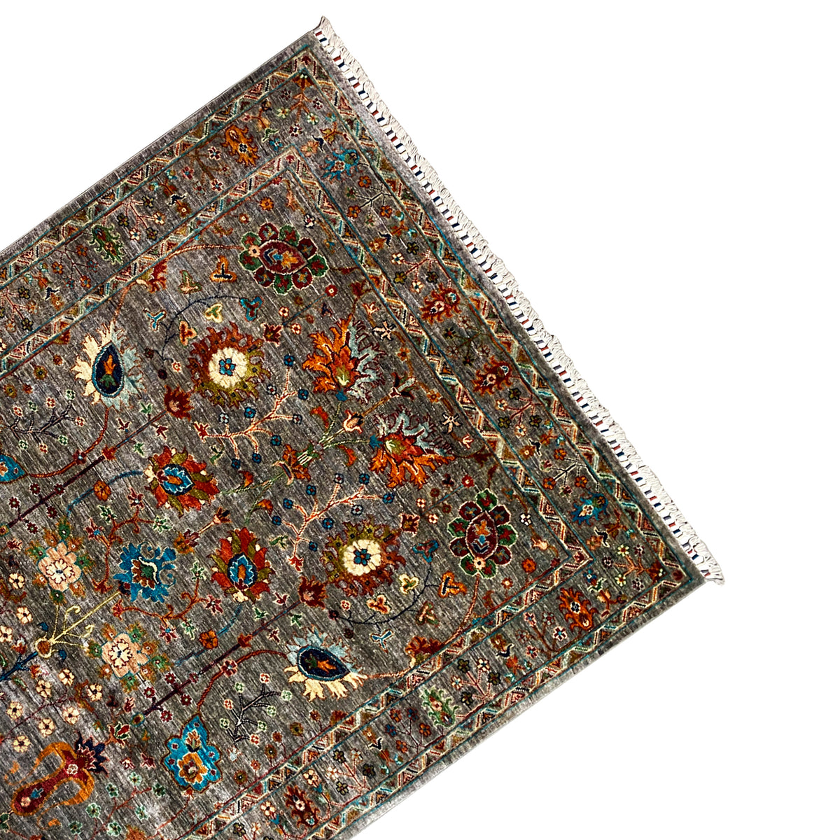 Gray corner Khorjin rug; multicolored decorative motifs, border, and fringe along the hem