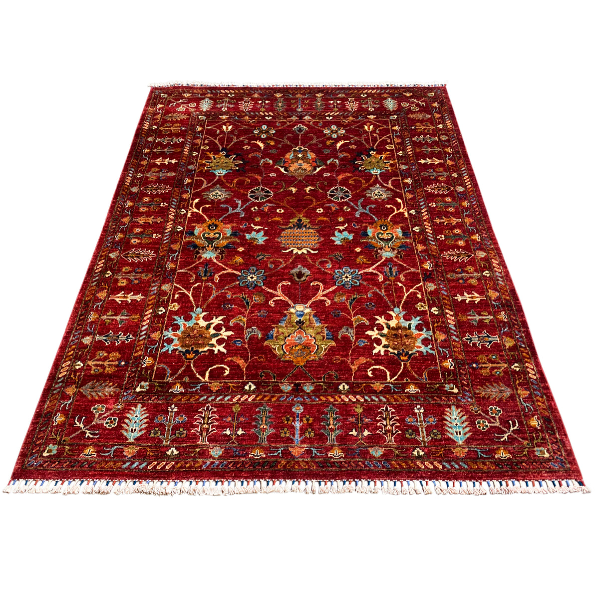 Red Khorjin rug with a central medallion and ornaments, rectangular, fringes