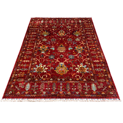 Red Khorjin rug with a central medallion and ornaments, rectangular, fringes