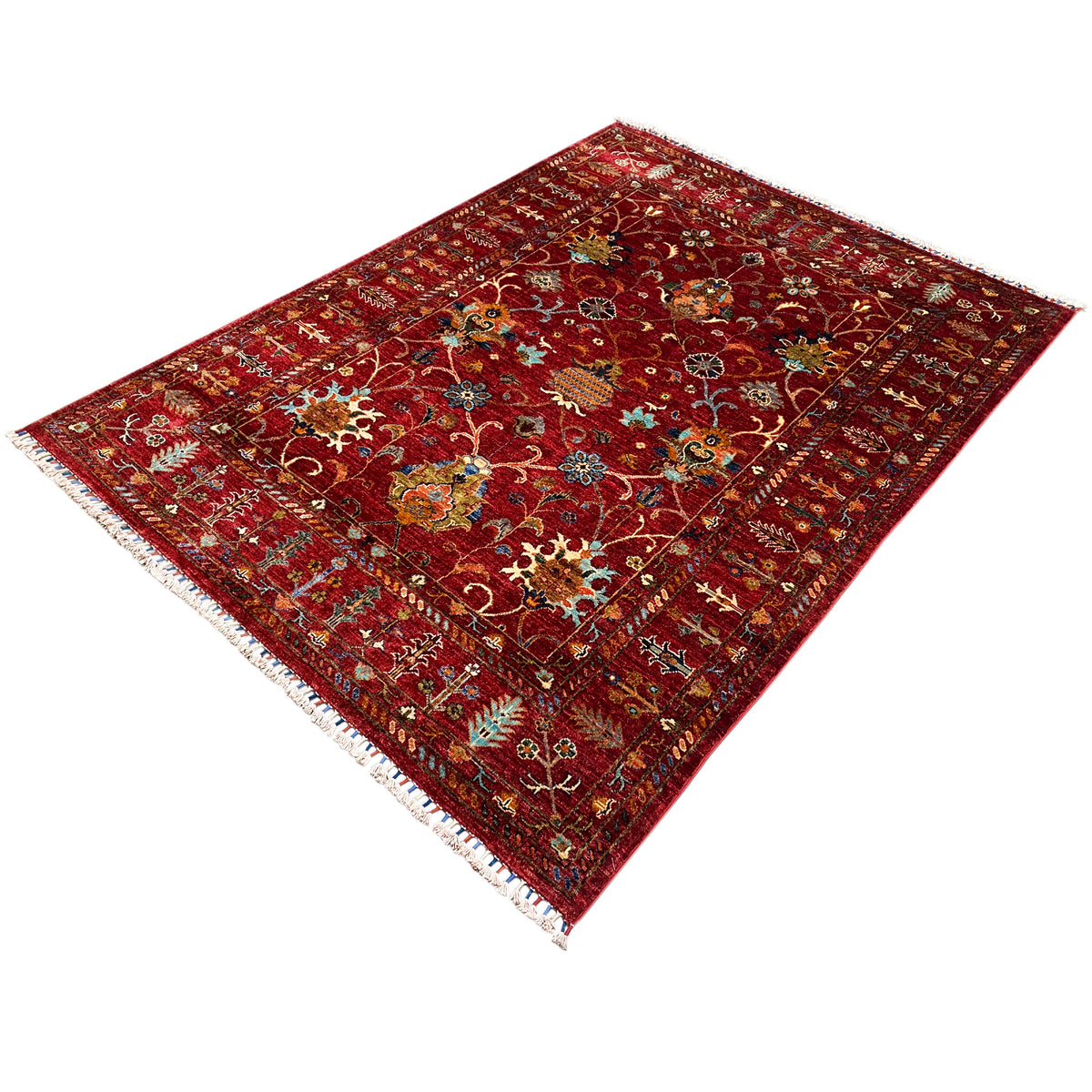 Red khorjin rug, square appearance from an angled view, ornamental pattern, fringes