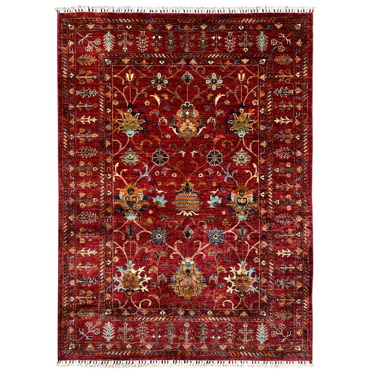 Red Khorjin rug with a multicolored ornamental pattern, rectangular, with border and fringes
