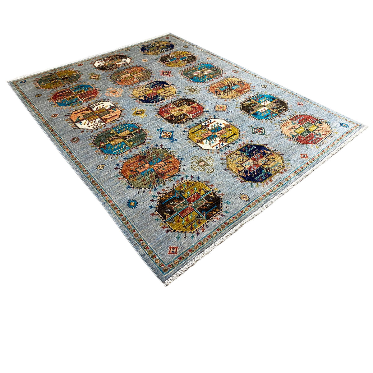 Ziegler rug in a light-blue design with colorful medallions, photographed diagonally