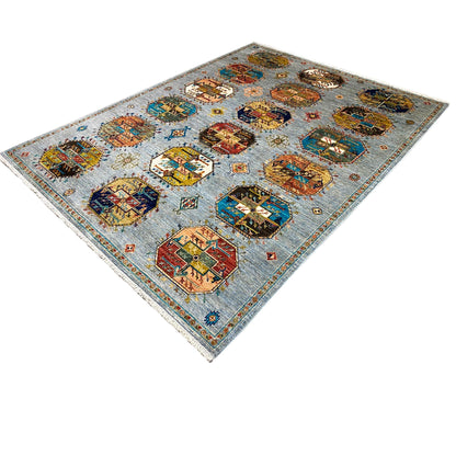 Ziegler rug with colorful ornamental panels and decorative border, viewed diagonally from above