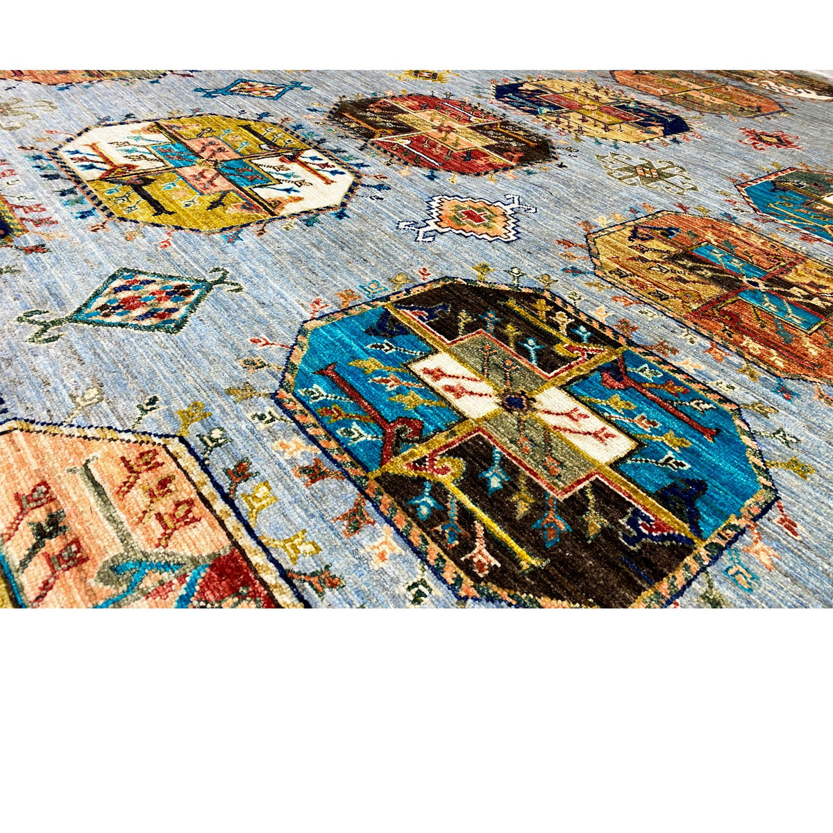 Ziegler carpet: Detailed view of the colorful ornamental panels on a light background