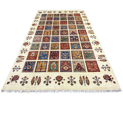 Wool rug with a square patchwork pattern in blue, red, and green on a light background