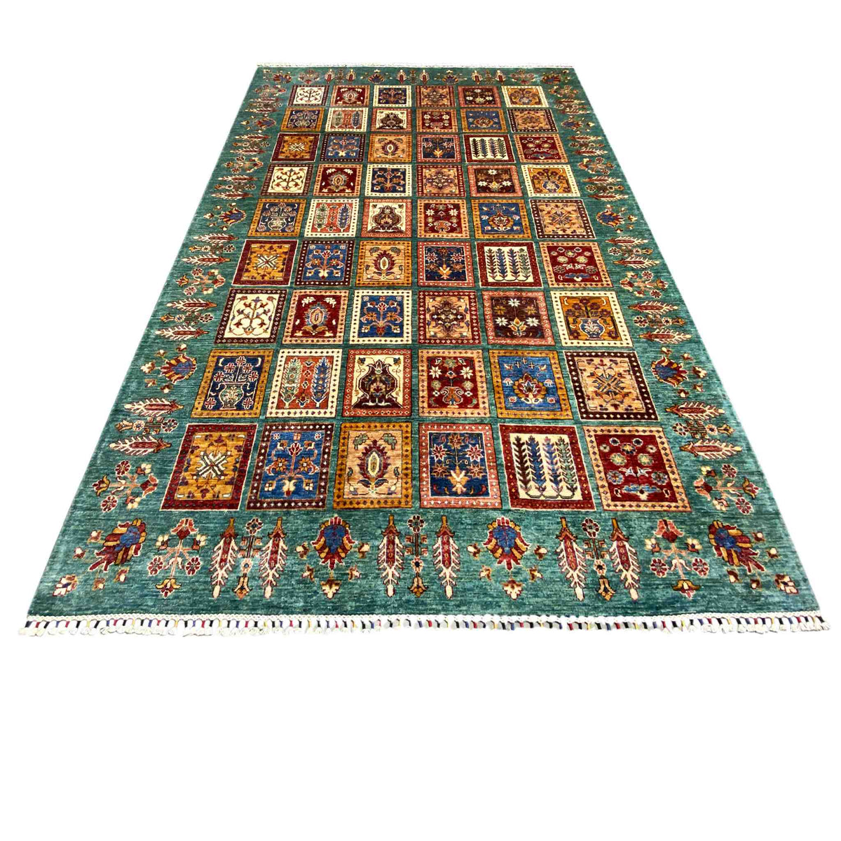 Ziegler rug in a patchwork tile pattern, petrol blue with decorative border and fringes