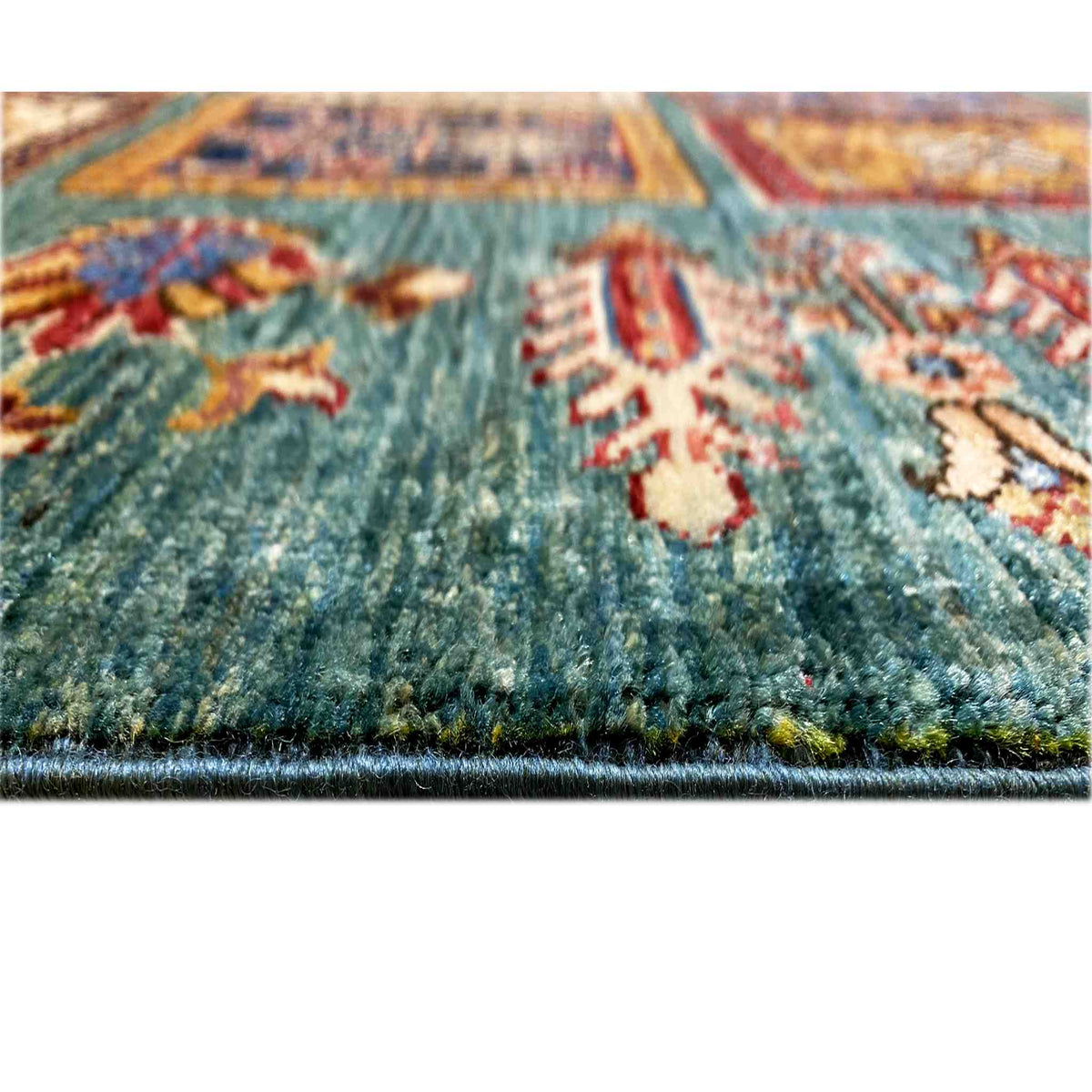Ziegler carpet detail view: short pile on a petrol-blue background with ornaments
