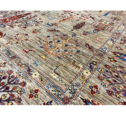 Close-up of a Ziegler rug with a geometric border and colorful medallion motifs