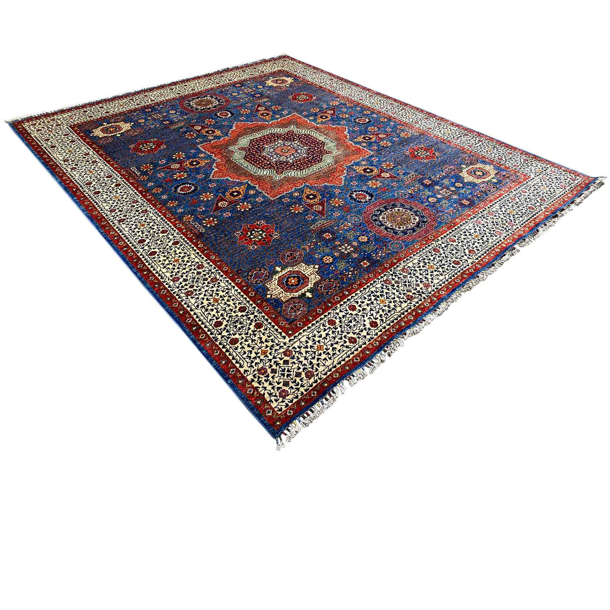 Ziegler rug, diagonal view: blue patchwork Oriental pattern with a beige border