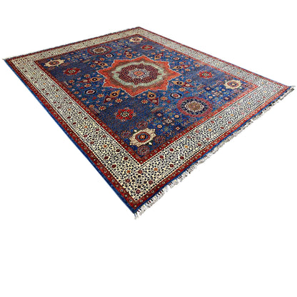 Ziegler rug, diagonal view: blue patchwork Oriental pattern with a beige border