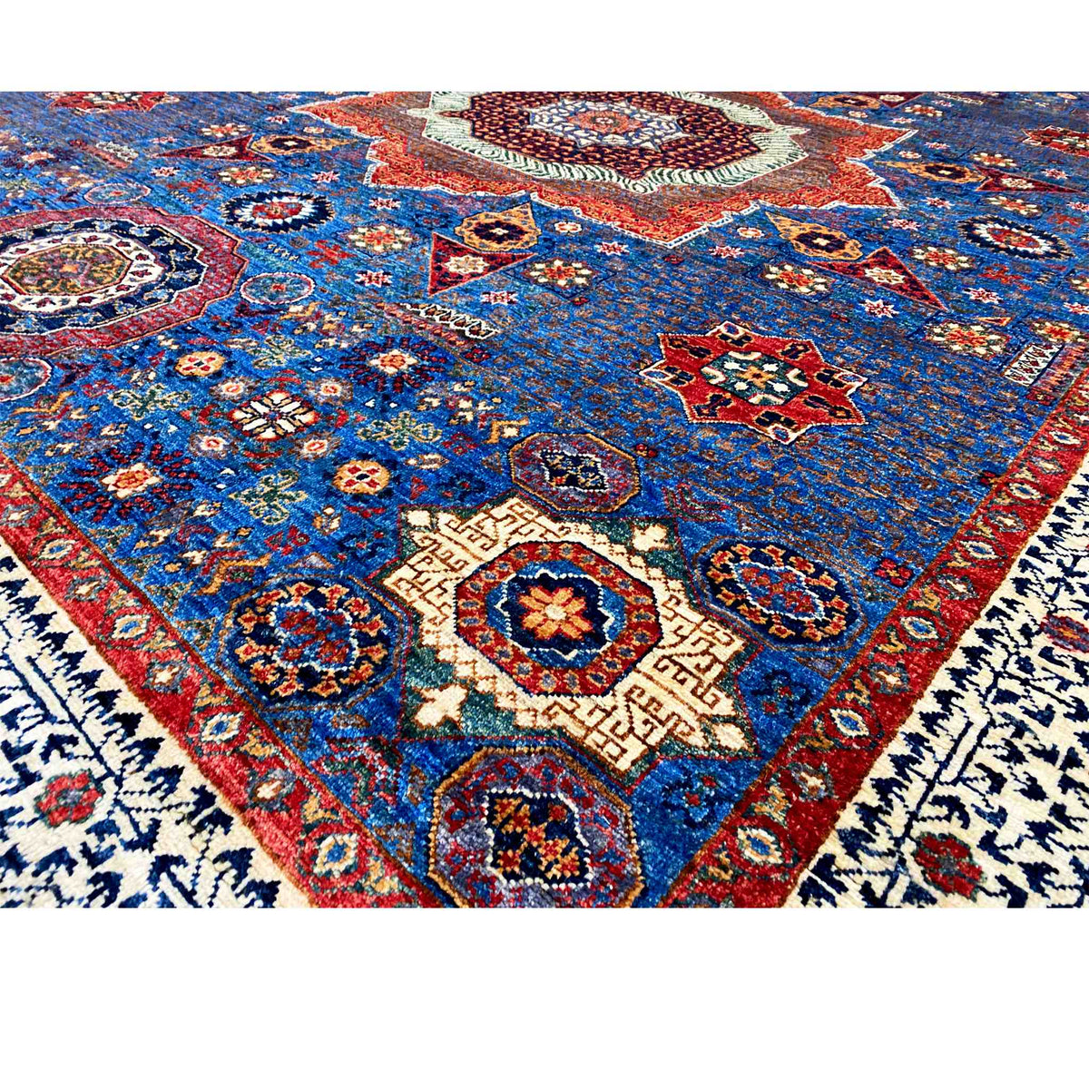 Ziegler carpet detail view: densely woven blue Oriental pattern with red accents