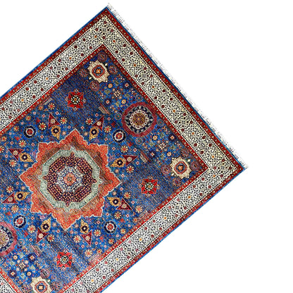 Ziegler carpet corner: blue medallion ornament, beige border, and red side line
