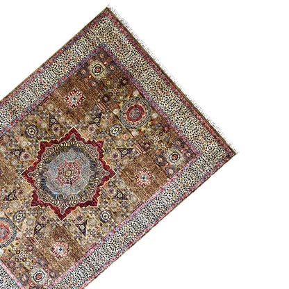 Rug viewed from the side at a three-quarter angle, ornate, brown-beige, blue, red