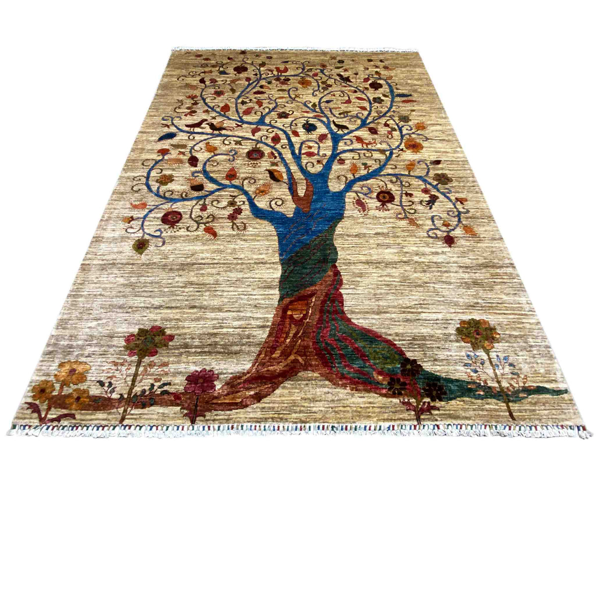Rug with a large tree motif in blue and red on a beige background, fringes