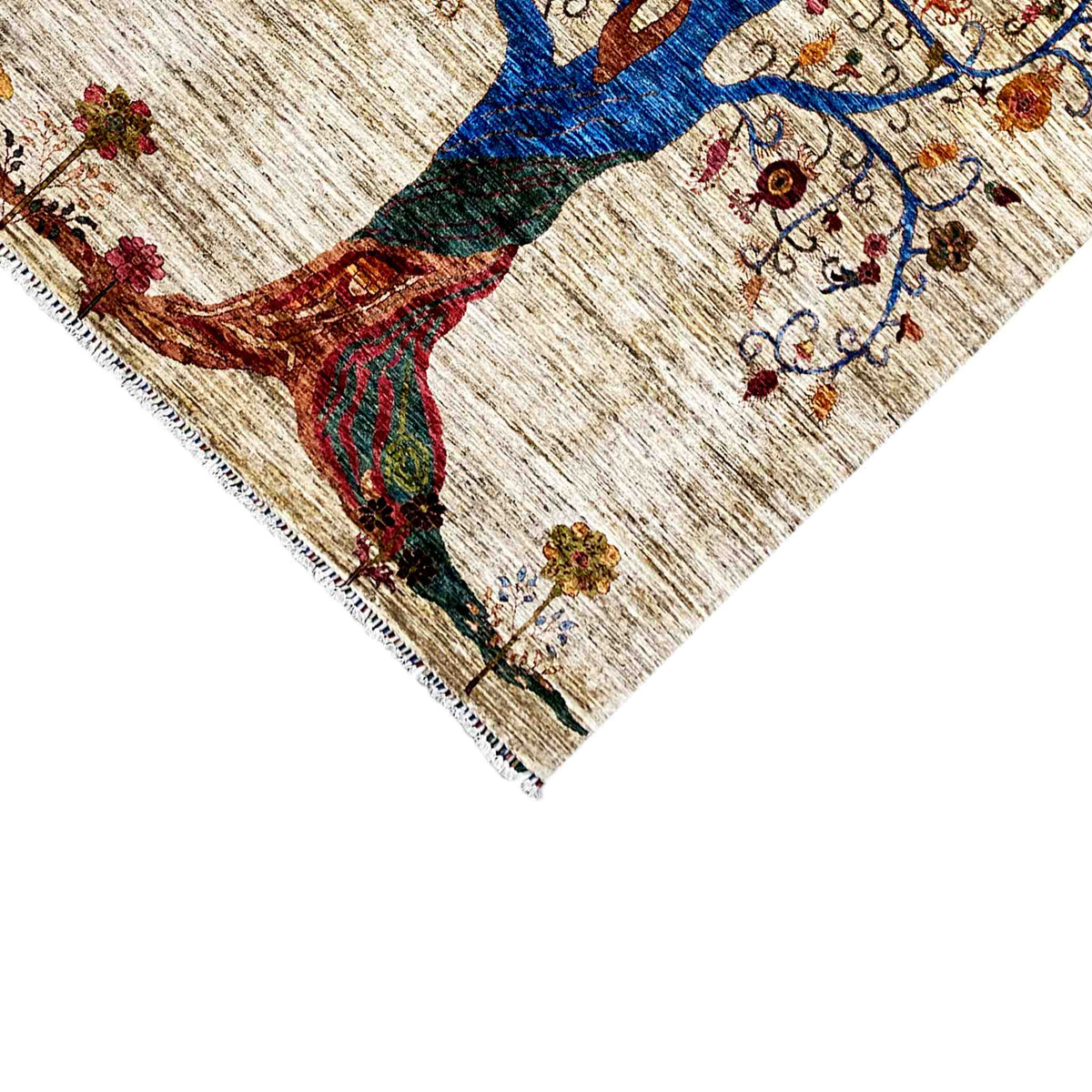 Rug corner with a tree motif and colorful flowers, beige background, fringes
