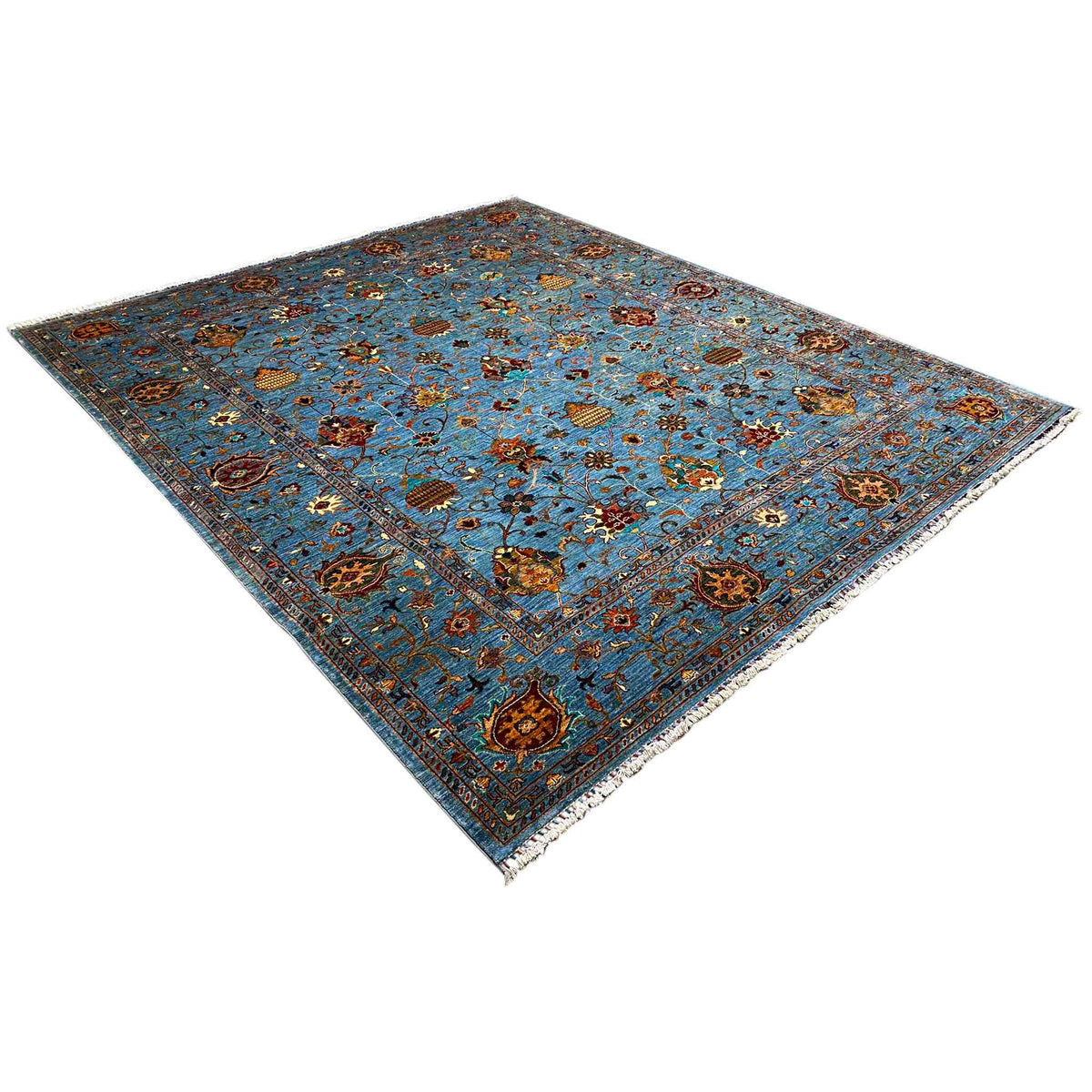 Blue carpet with medallions, floral embellishments, and an ornamental border