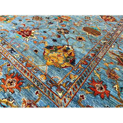 Detailed view: blue pattern with floral ornaments, lines, and decorative border