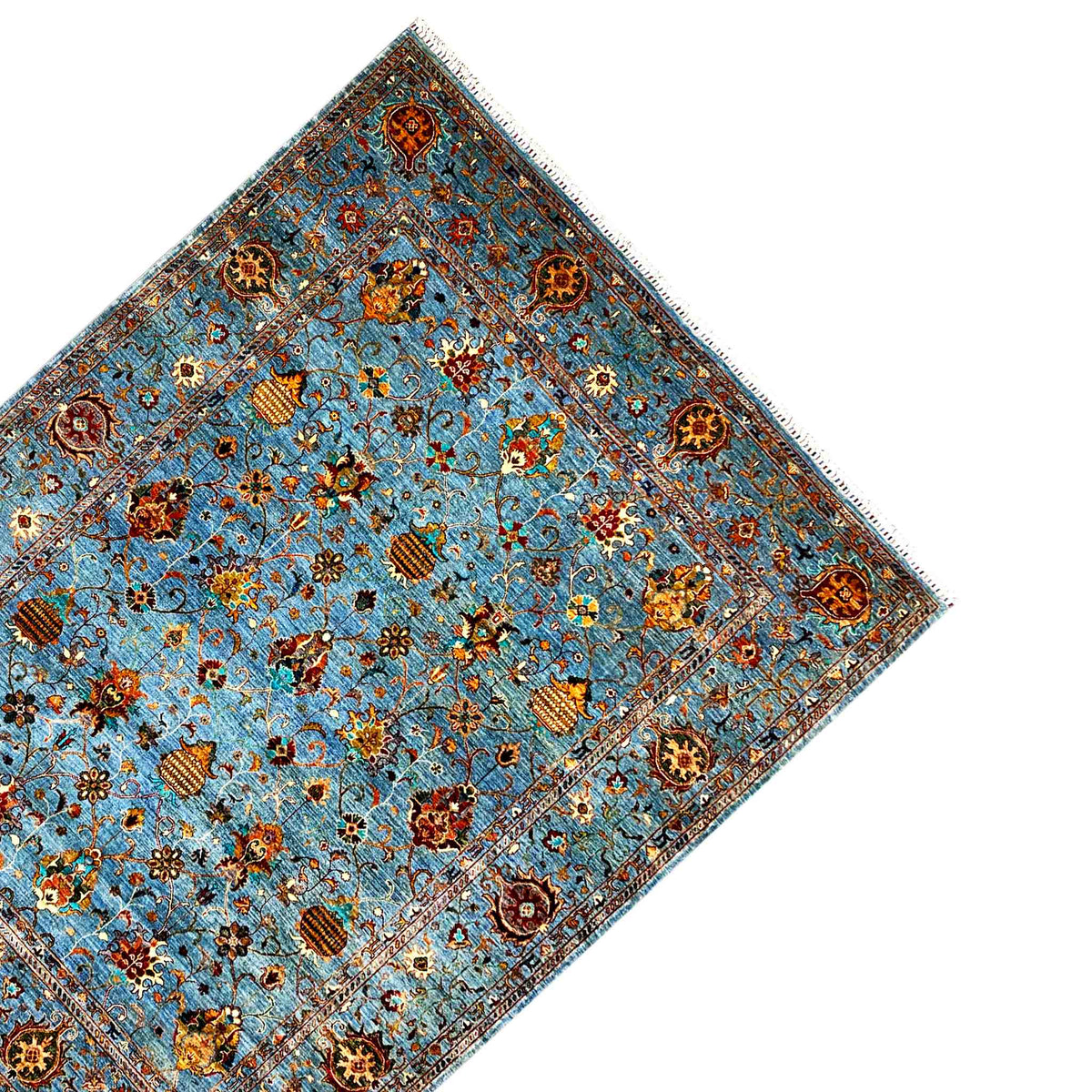 Corner view: blue carpet with ornamental medallions and a decorative border