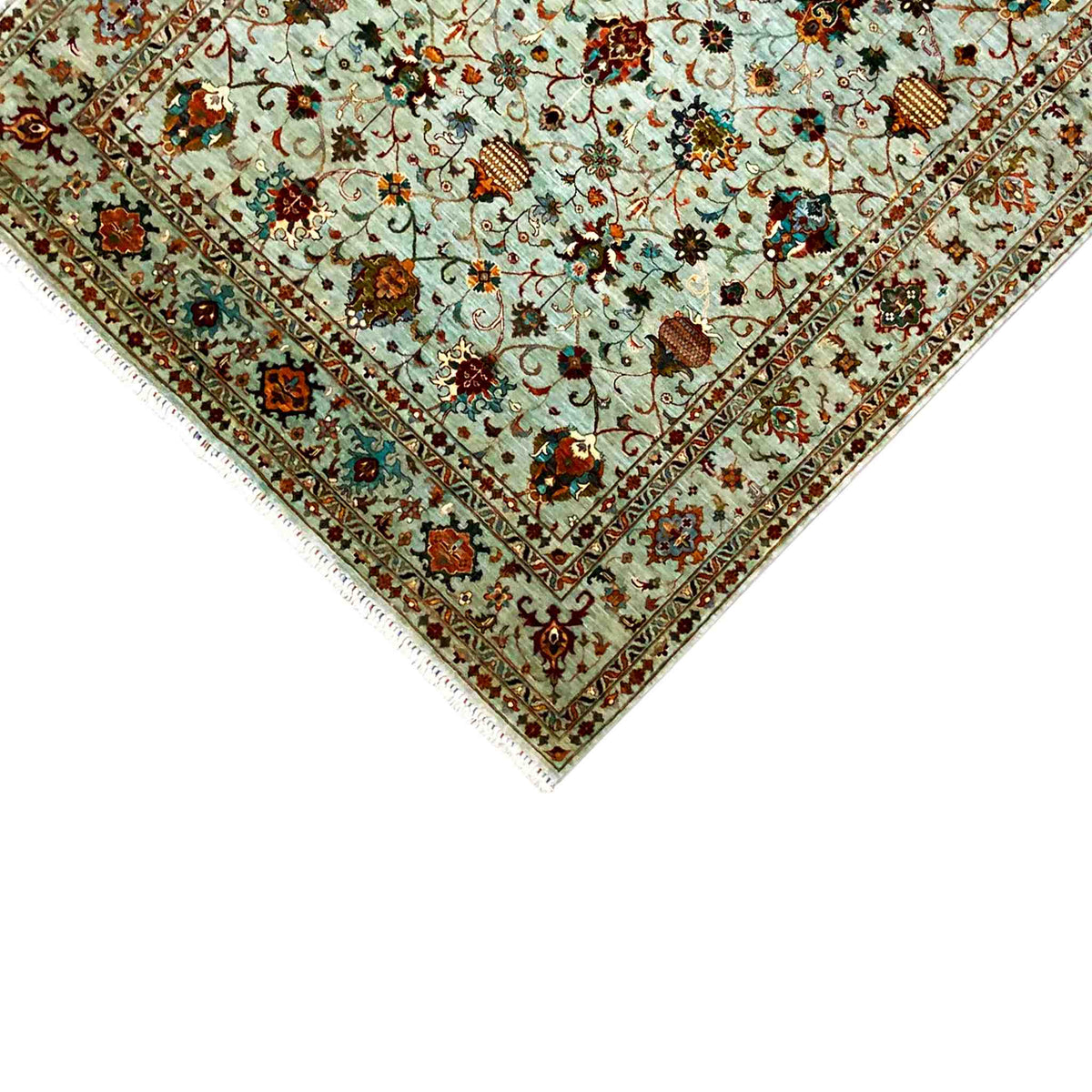 Tea-corner detail: light blue background, dark border, and floral ornaments