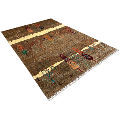 Rug in 3/4 view: brown textured fabric with colorful ornaments and fringes
