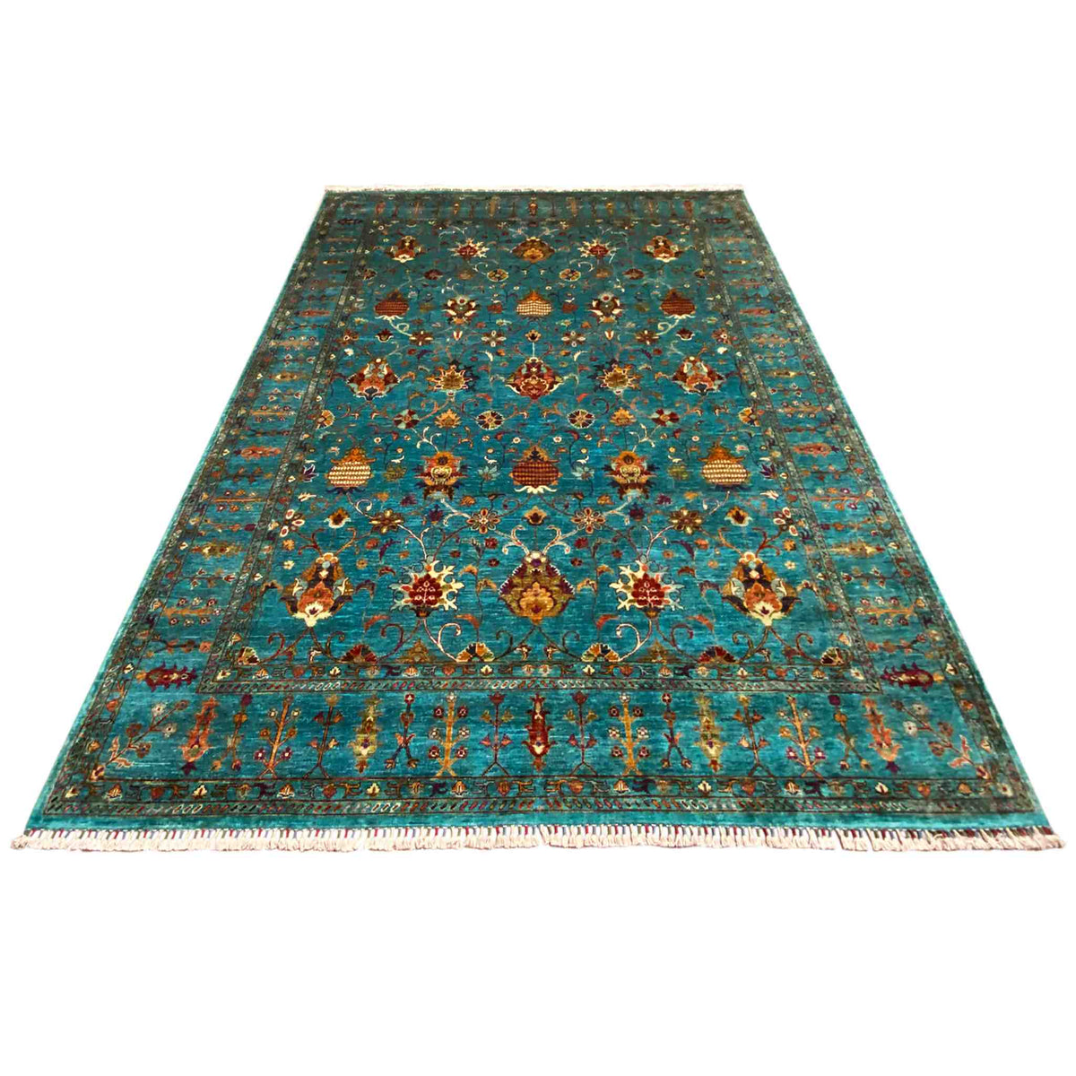 Rectangular rug with a decorative ornamental pattern in turquoise, gold, and red, with fringes