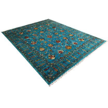 Rug with a geometric Oriental pattern in turquoise, gold, and red, angular appearance
