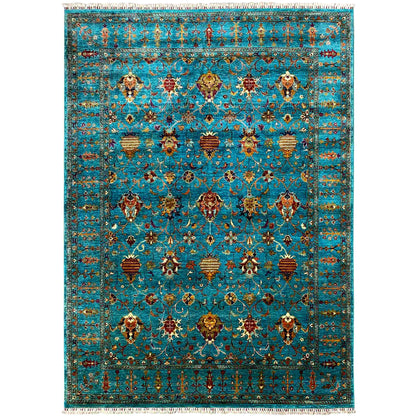 Rectangular rug with an ornamental pattern in turquoise, gold, and red, with fringes