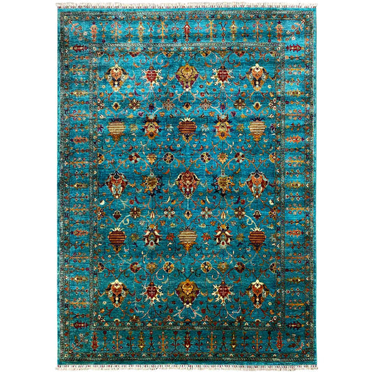 Rectangular rug with an ornamental pattern in turquoise, gold, and red, with fringes