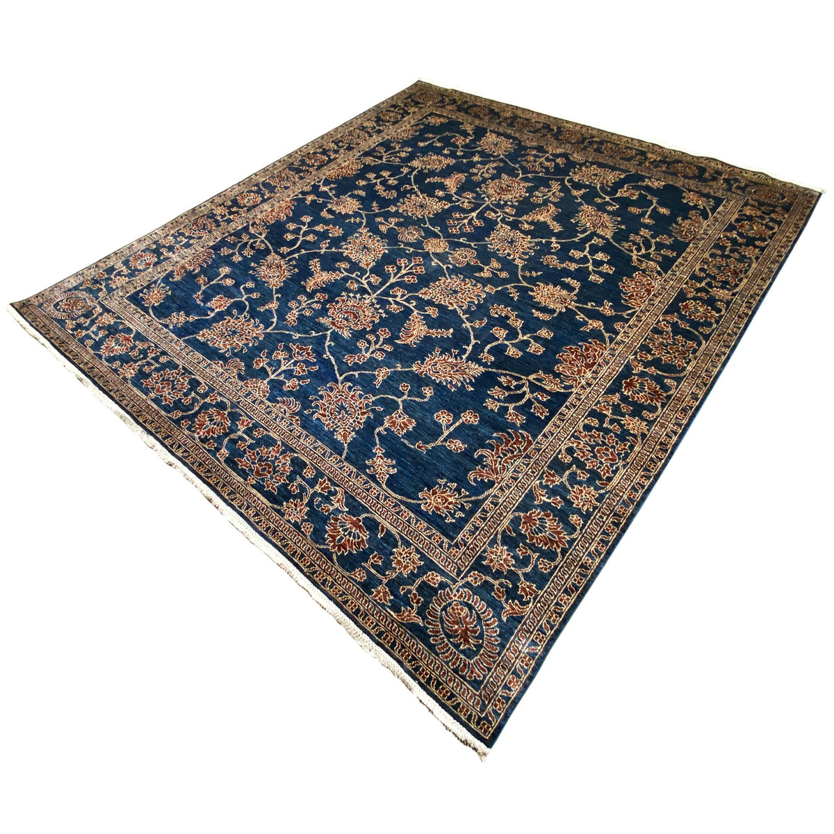 Blue Ziegler rug with golden floral vines, corner ornaments, and a bordered pattern